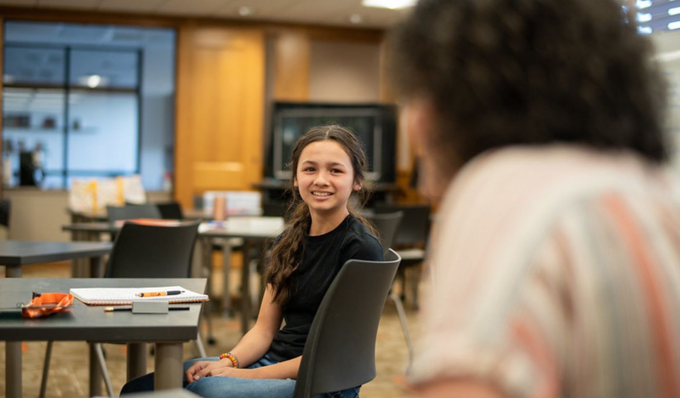 girl smiling at writing camp