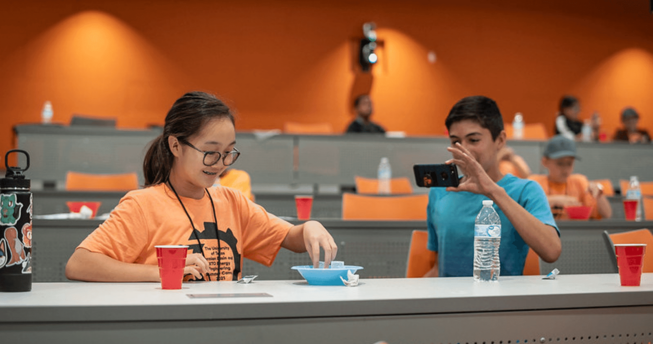 two students laughing doing a STEM project