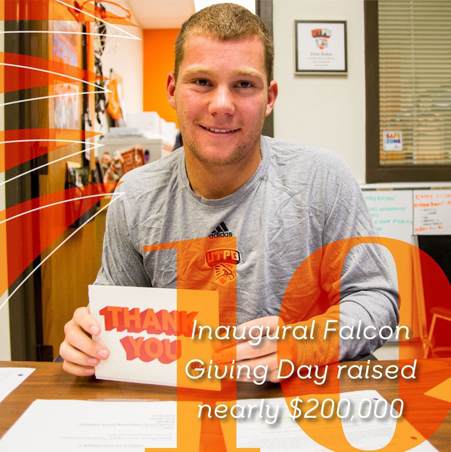 Student holding thank you card