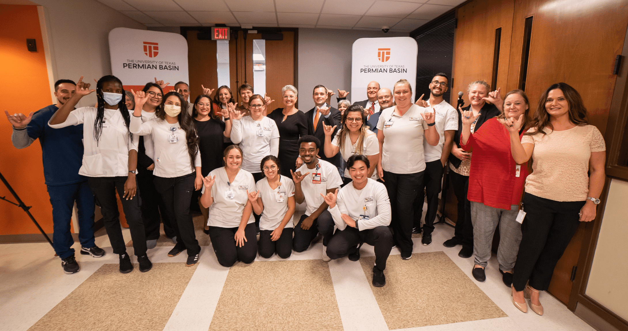 Nursing students along with University and Midland Health Officials pose for camera
