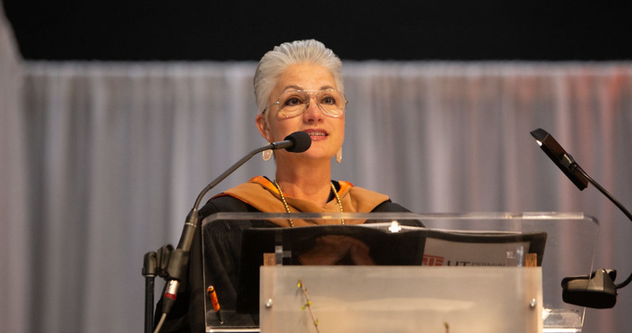 Dr. Woodley speaking at microphone